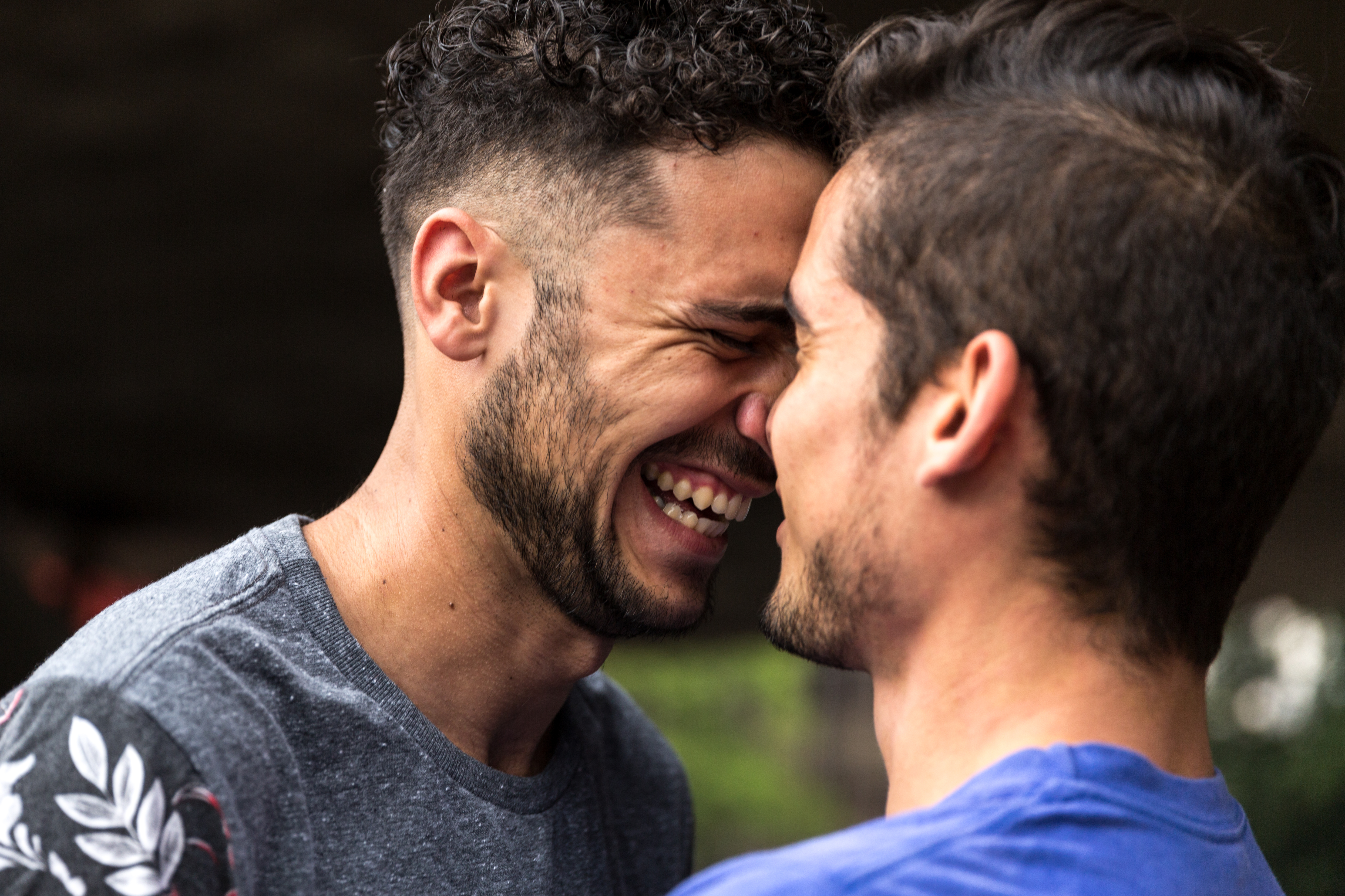 A couple face to face smiling