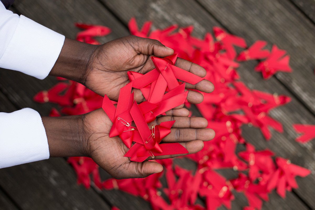 Red ribbons in hands