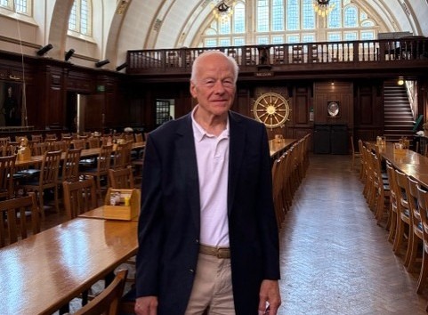 David standing in a hall.