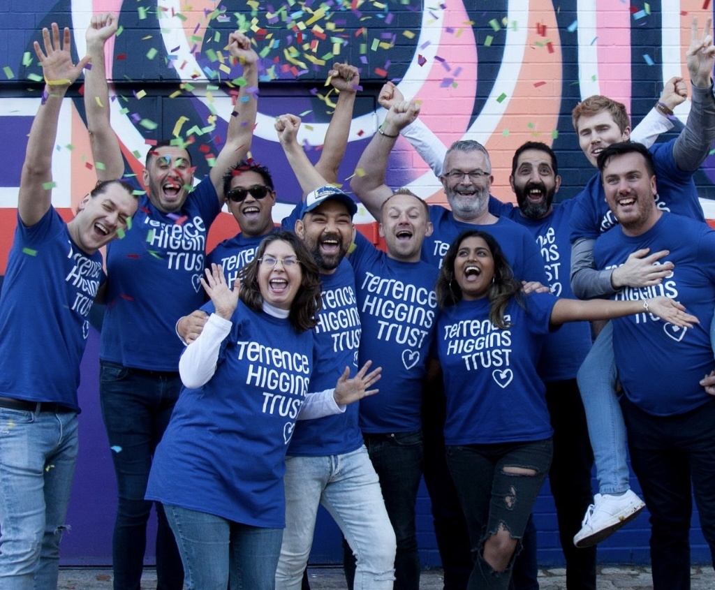 A group of smiling people with Terrence Higgins Trust t-shirts.