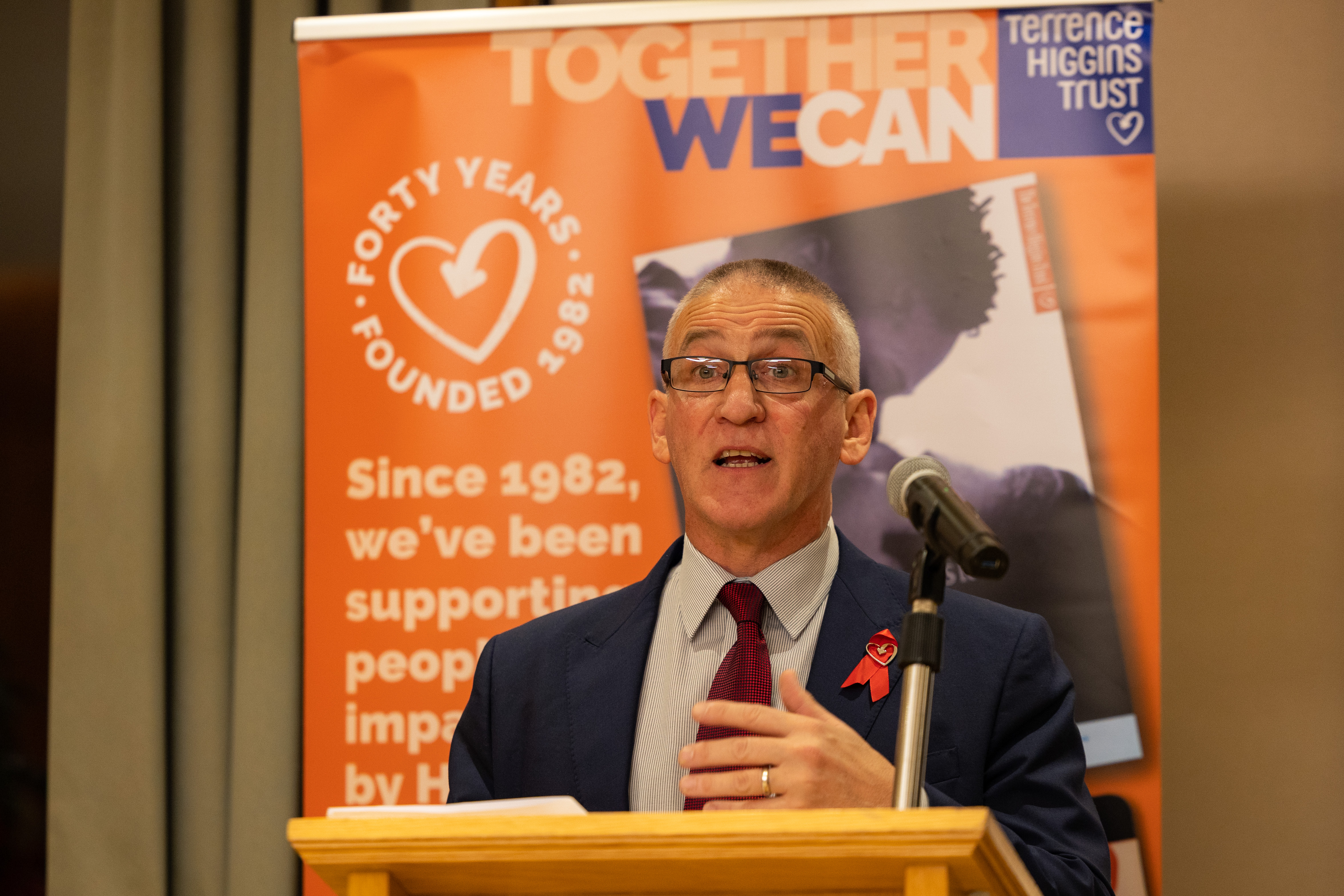 Ian Green at lectern giving speech