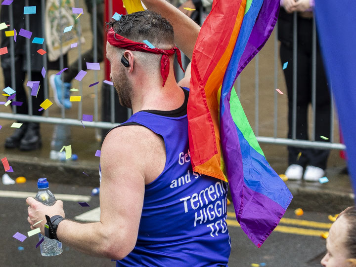 Matt running for Terrence Higgins Trust with rainbow flag