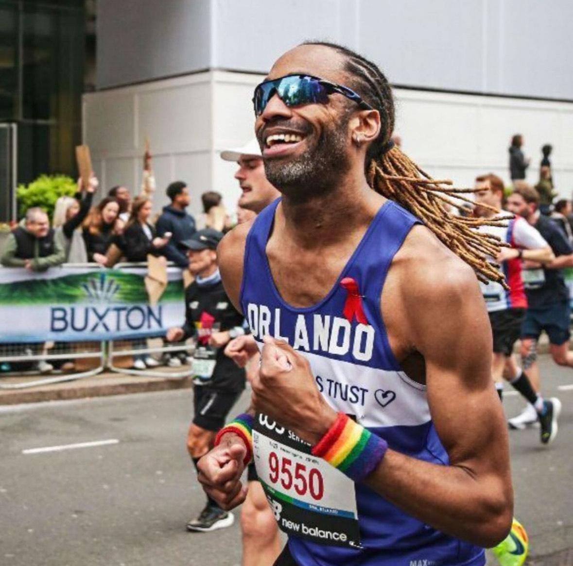 A smiling Terrence Higgins Trust marathon runner.