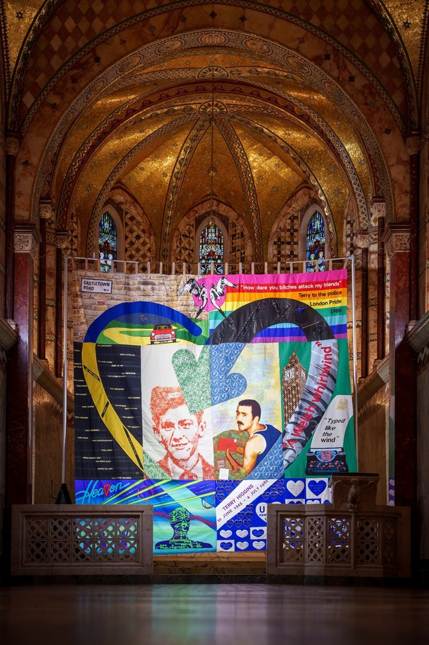 The entire Terry Higgins Quilt, in the centre of a church backdrop.