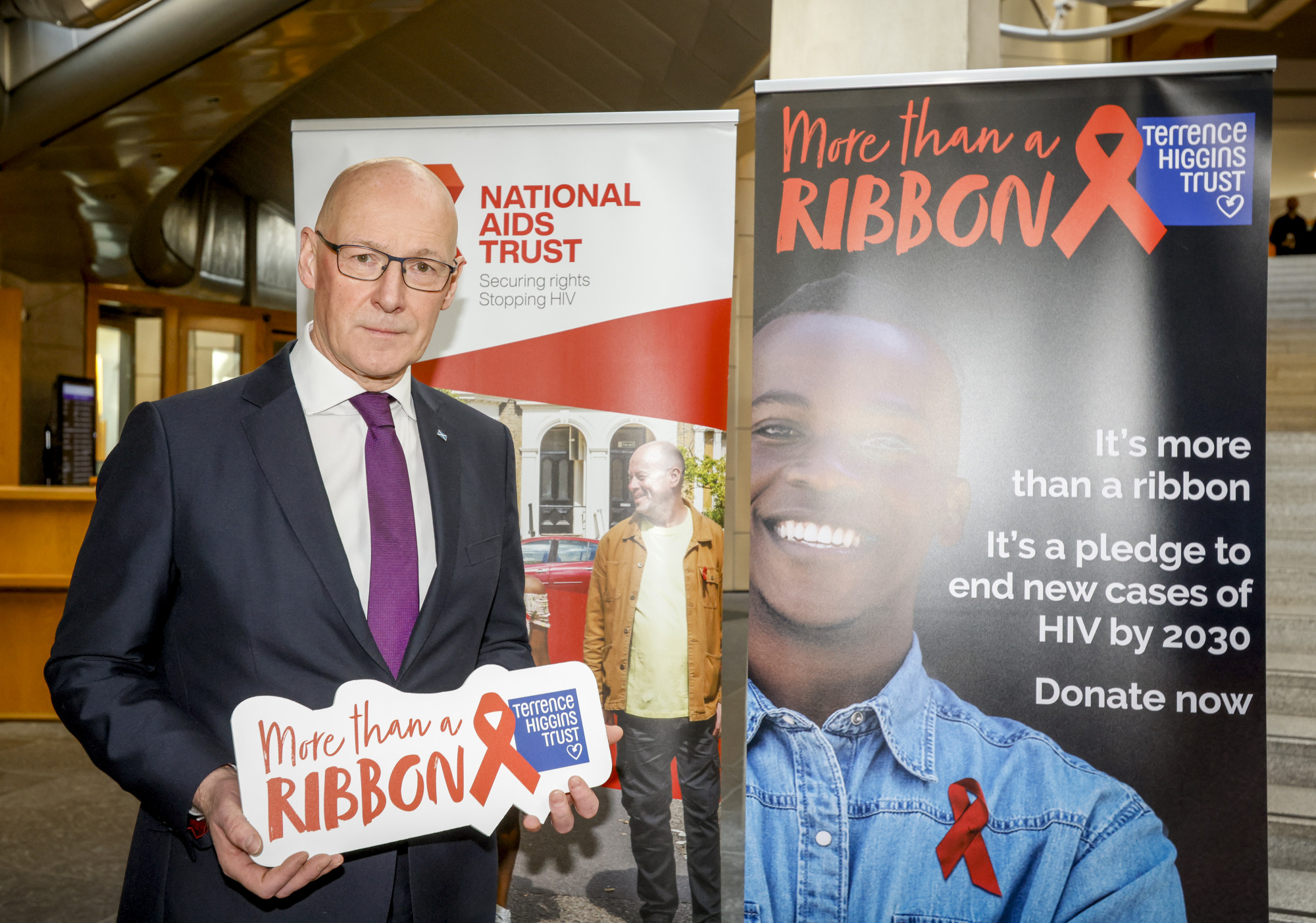 John Swinney MSP commemorating World AIDS Day in the Scottish parliament.