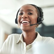 Stock image of a smiling call handler.