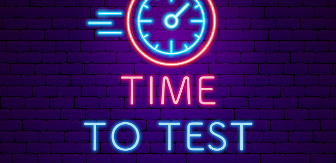 "Time to test" in neon sign imagery.