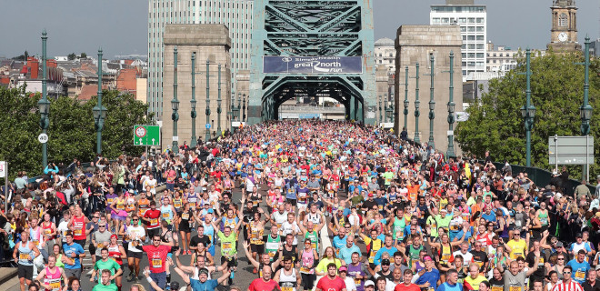 Great North Run runners on bridge