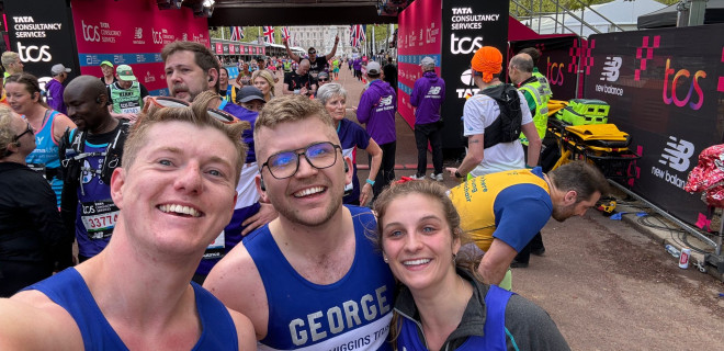 Three Terrence Higgins Trust marathon runners smiling for a selfie.