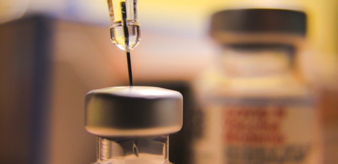 Close up of a needle within a jar.