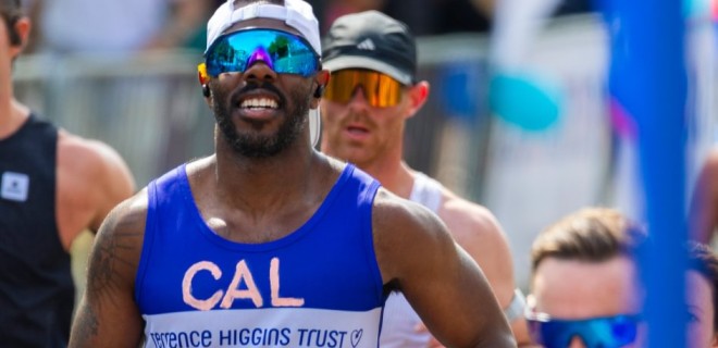 A Terrence Higgins Trust runner in the 2026 London Marathon with sunglasses.