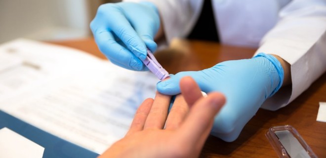 Someone having a fingerprick HIV test.