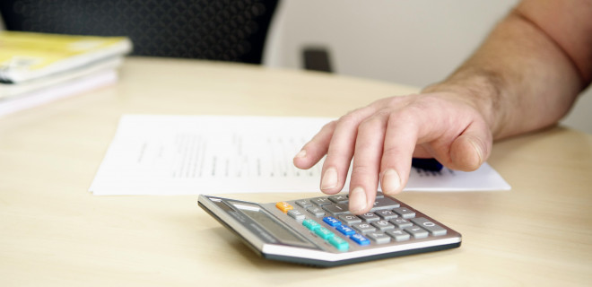 Man using calculator