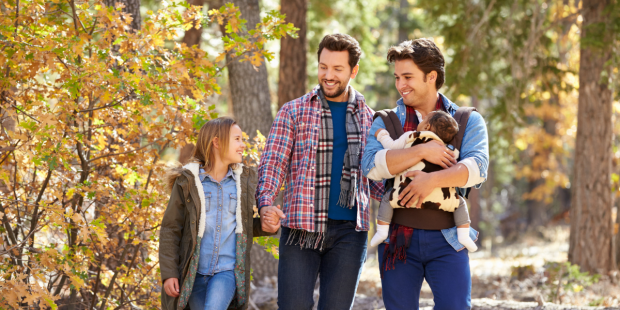 A family walk together in the forest.
