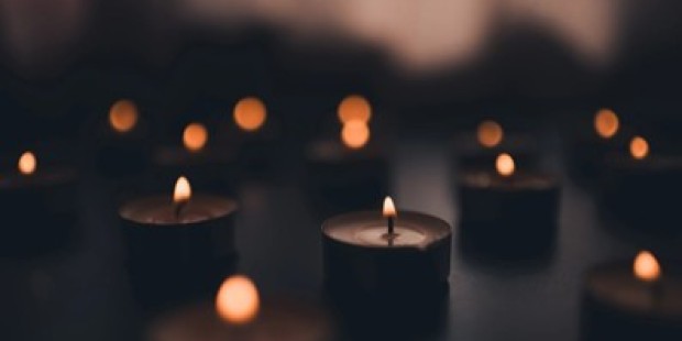 A close up of lit candles.