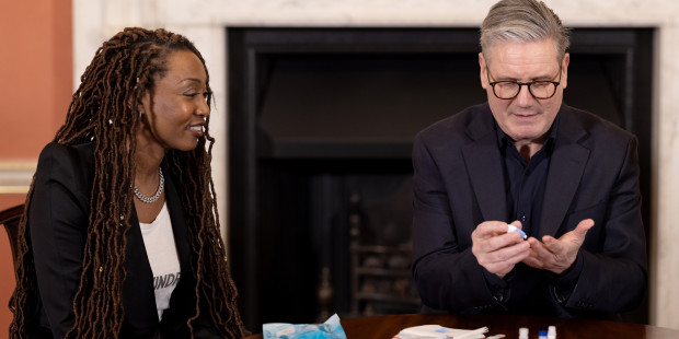 Sir Keir Starmer and Beverley Knight using a HIV self test kit