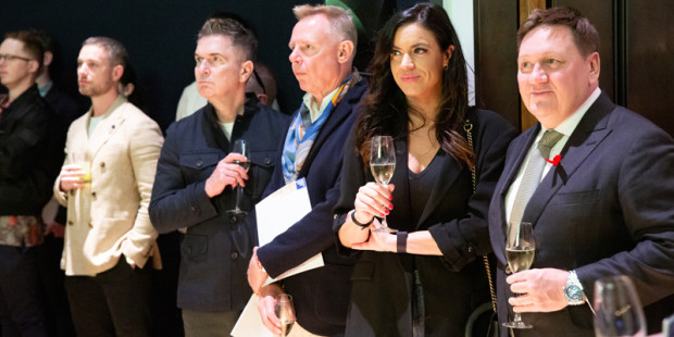 Line up of people watching The Auction 2024