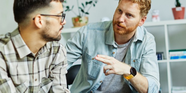 Two people talking with hand gestures