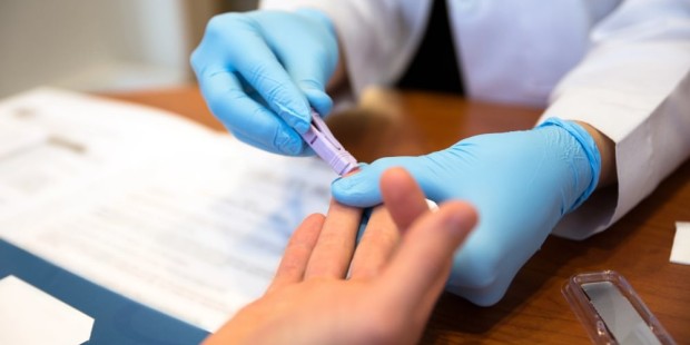 Someone having a fingerprick HIV test.